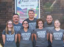 Members of the Fast Color Print team proudly wear the newly designed "Mission Shirts." The sale of the shirts will directly benefit the Patriot Guard Riders' "Help on the Homefront" mission, which provides emotional and financial assistance for wounded soldiers and veterans.